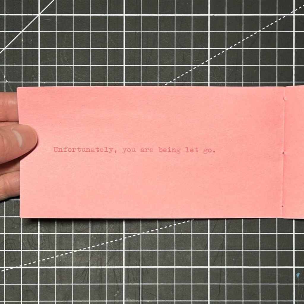 Interior spread of The Beginning of the Rest of Your Life with the typewritten sentence ‘Unfortunately, you are being let go.’