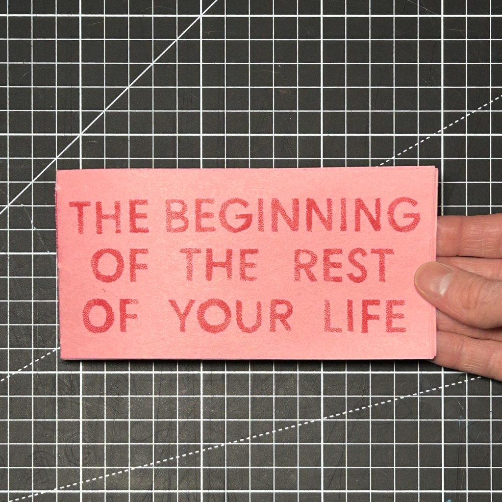 The Beginning of the Rest of Your Life, a handmade pink pamphlet-stitched zine with a red hand-stamped title.