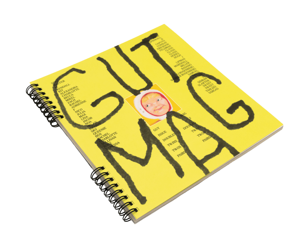 GUTMAG Issue 2: DOUBLES, a yellow twin-loop-bound artist magazine, photographed on white.