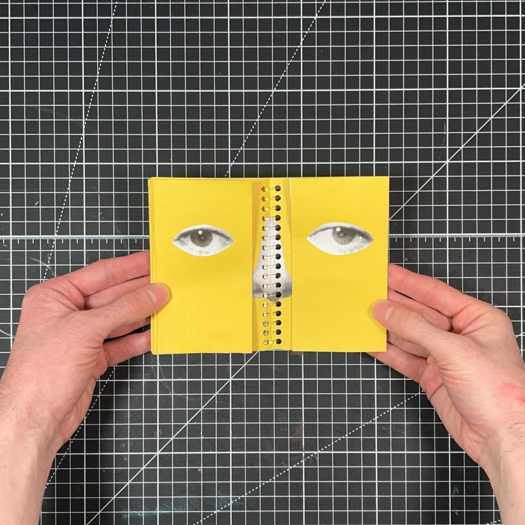 Open yellow spread from Blink and You’ll Miss It with collaged open eyes and a receipt-paper nose around the clear spiral binding.